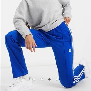Adidas Originals three stripe track pants in blue